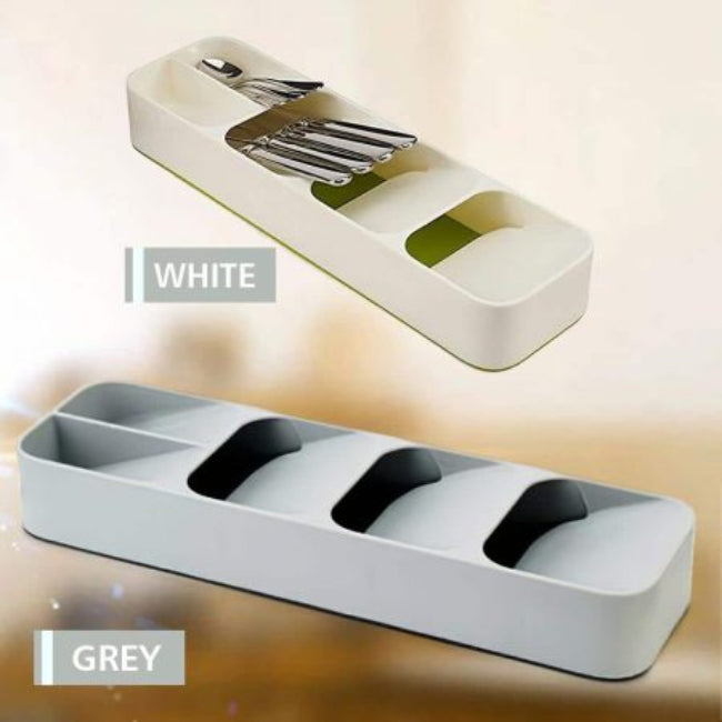 Multi-layer kitchen drawer cutlery organizer tray in grey, shown with spoons, forks, and knives stored vertically in the tiered, overlapping compartments for maximum space saving.