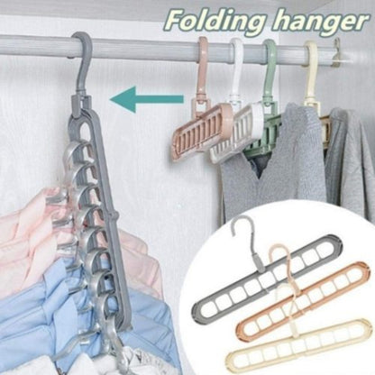 9-hole folding clothes hanger sorting rack shown vertically in a small closet to save space, white organizer