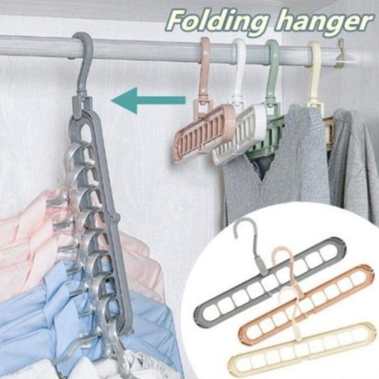 9-hole folding clothes hanger sorting rack shown vertically in a small closet to save space, white organizer