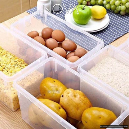 Clear plastic containers with food items on a wooden table