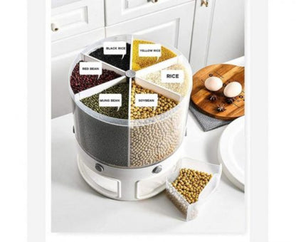 10KG transparent plastic rotating rice and grain dispenser with 6 internal partitioned compartments, shown sitting on a countertop with various grains stored inside.