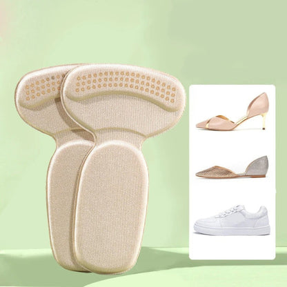 One pair of light grey adhesive memory foam heel cushion pads, shown being stuck into the back heel lining of a black shoe to demonstrate anti-wear protection and improved fit.