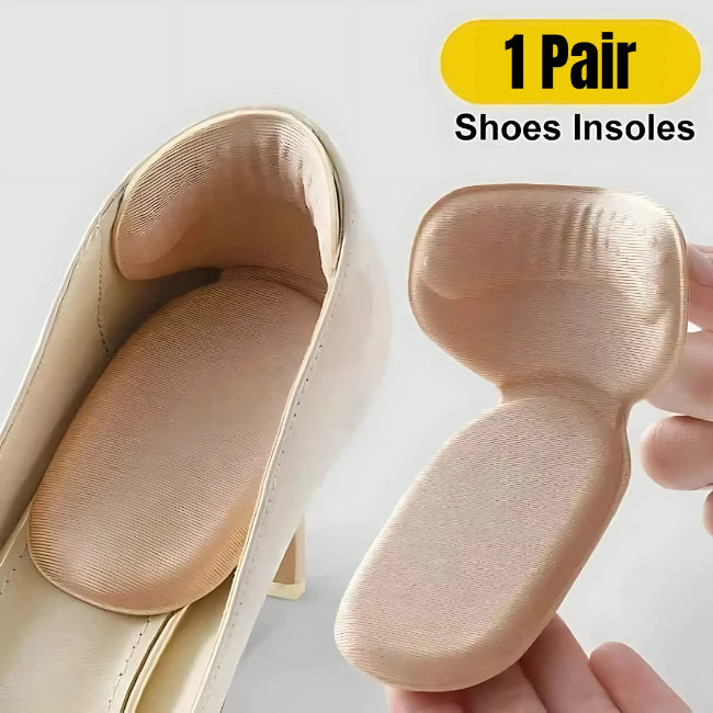 One pair of light grey adhesive memory foam heel cushion pads, shown being stuck into the back heel lining of a black shoe to demonstrate anti-wear protection and improved fit.