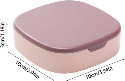 Closed view of a portable jewelry organizer travel box in blush pink, with the lid open showing velvet interior compartments and a built-in mirror.