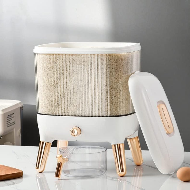 Large 12KG airtight plastic rice and grain storage box with a white lid and transparent body, shown sitting on a kitchen counter next to a scoop, filled with white rice.