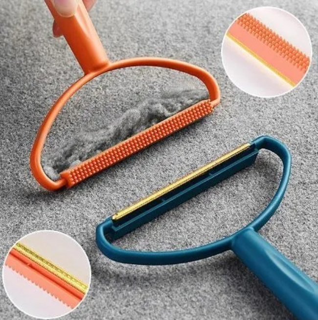 A close-up of a portable, battery-free manual fabric shaver and lint remover with a copper head, shown revitalizing a gray wool sweater.