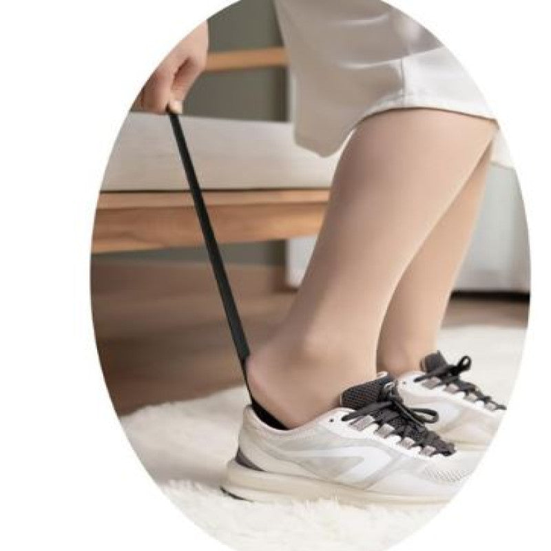 Long handle shoe horn helping with easy shoe wearing