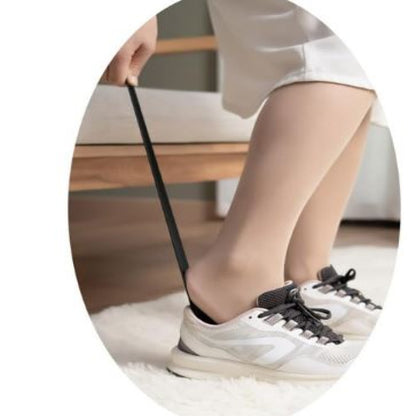 Long handle shoe horn helping with easy shoe wearing