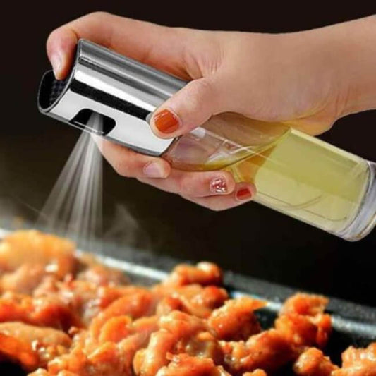 Hand using a salt or pepper shaker over food on a grill
