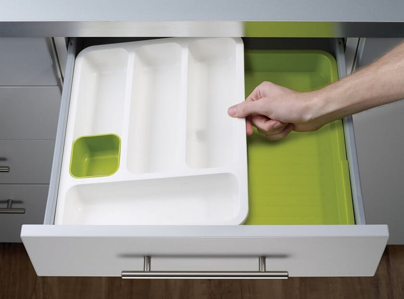 Expandable 2-tier plastic cutlery tray organizer shown fully extended in a kitchen drawer, neatly separating spoons, knives, and forks in the multiple layered compartments.