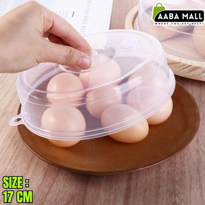 Eggs in a transparent plastic cover on a wooden surface with 'AABA MALL' branding.