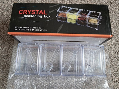Crystal seasoning box with compartments on a gray surface