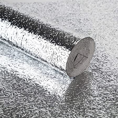 Self-adhesive aluminum foil sticker roll showing textured surface and adhesive backing