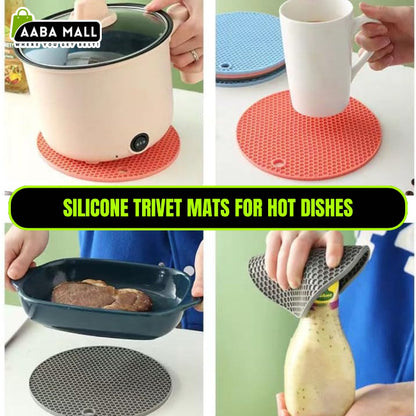 Set of geometric-patterned food grade silicone pot mats in red and black, shown with a hot metal pot placed on one to demonstrate heat resistance on a wooden countertop.