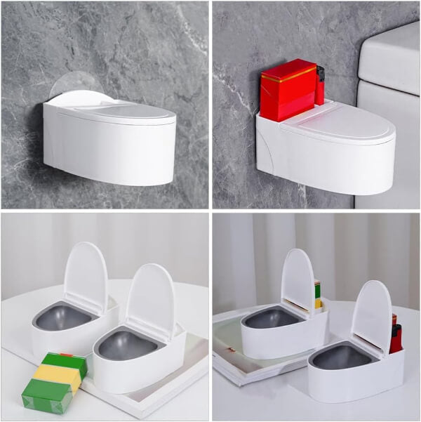 Toilet-shaped ashtray with a hand lighting a cigarette, on a gray background.