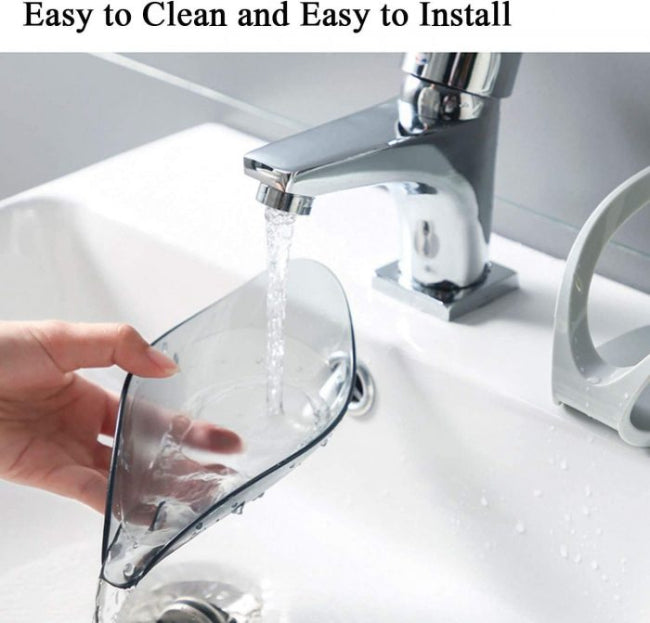 A green leaf-shaped self-draining soap dish holder with a suction cup base, shown on a sink edge, channeling water away from the soap bar.