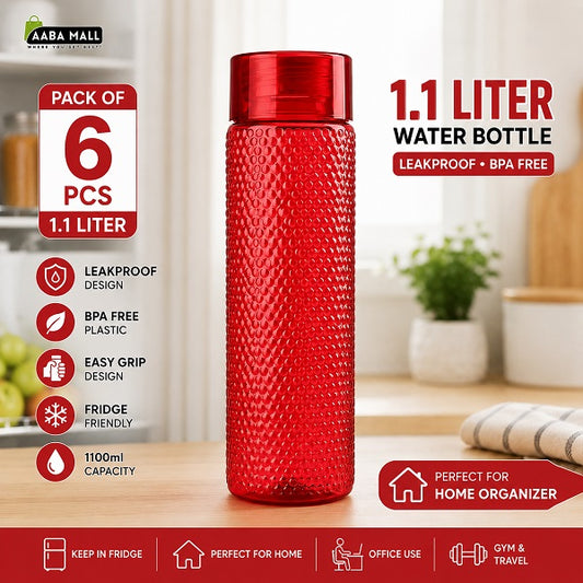 Red TENTA 1.1 Liter water bottle with textured design displayed in a home kitchen setting for refrigerator and home use
